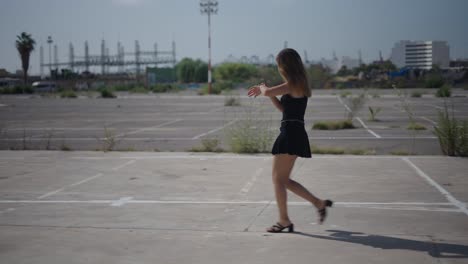 woman walking in an urban parking lot