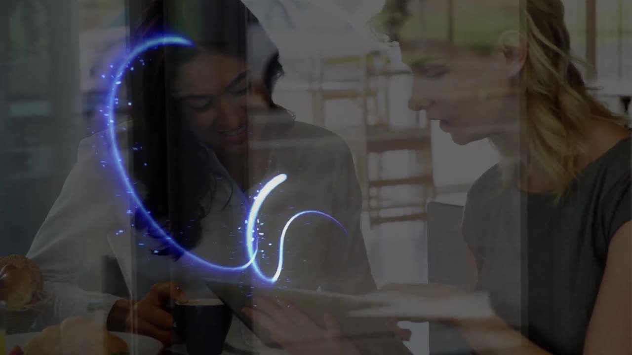 Animation of glowing lines over two female scientists