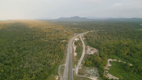 sunset aerial view at lundu bridge and river with green forest,mountain back ground.sarawak.