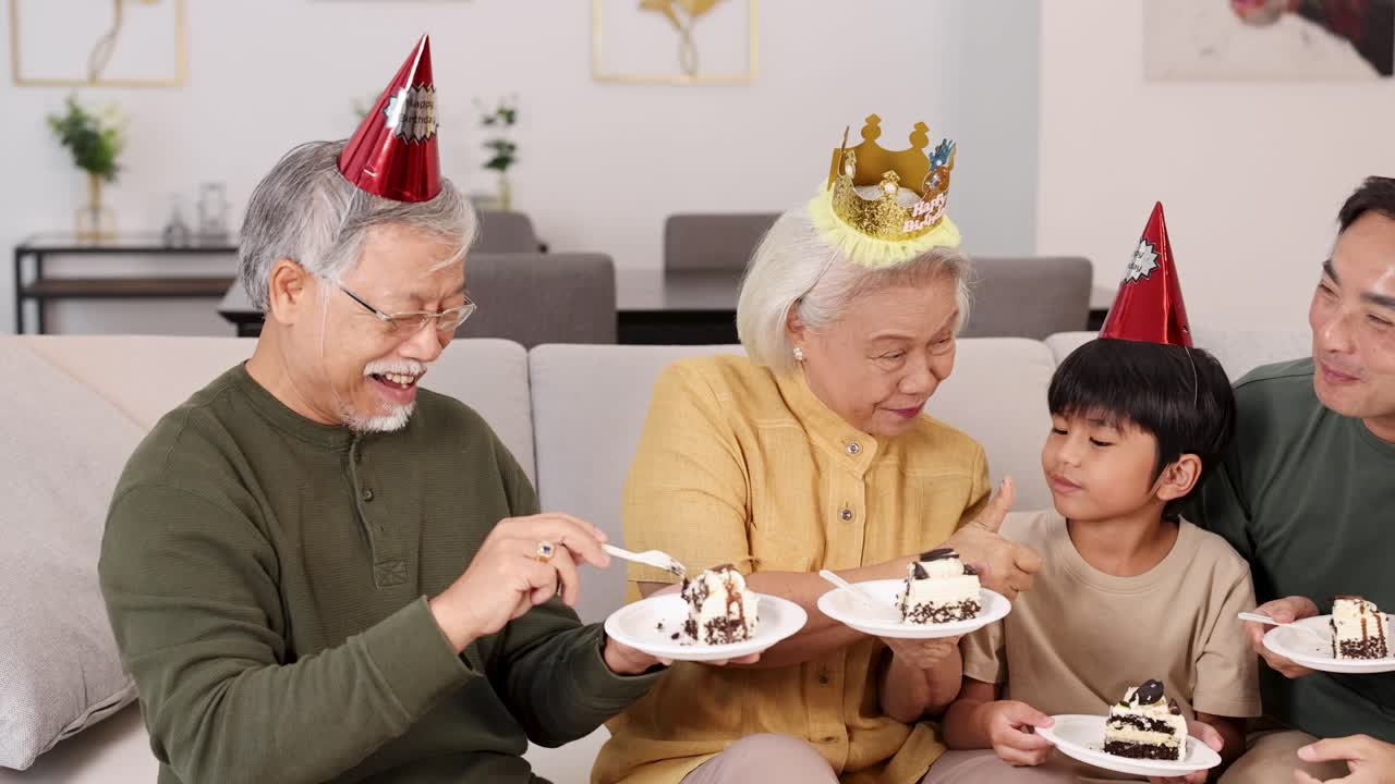 A joyful family gathering with cake, party hats, and laughter in a cozy living room setting
