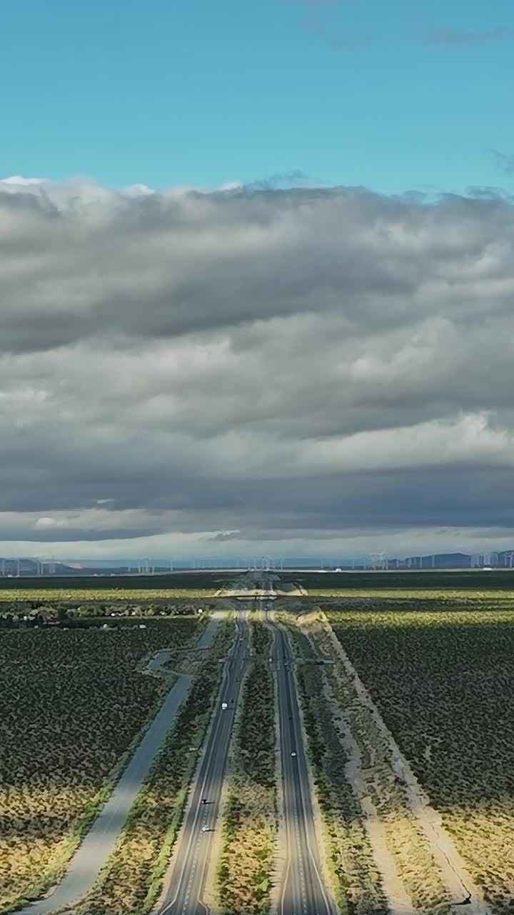 Wide view of open land with roads and mountains in the USA