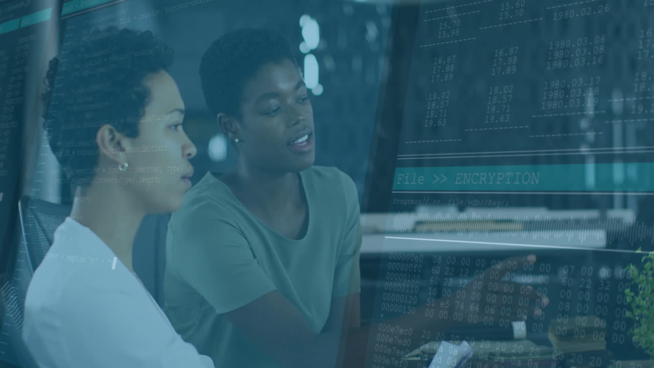 Encryption and data processing animation over two women working on computer