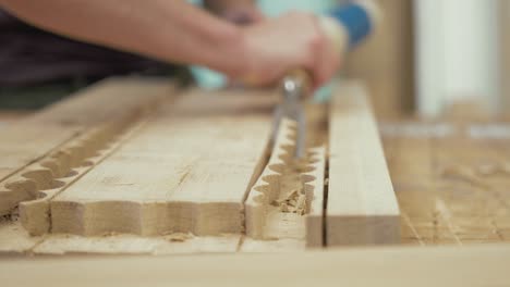 Carpenter-chiseling-out-recess-in-oak-timber