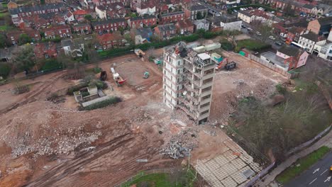 zoom in on a demolished building in norwich with flying birds and the surrounding area