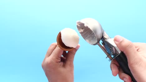 scooping ice cream into a cone