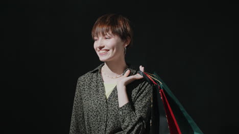 portrait of cheerful girl with shopping bags