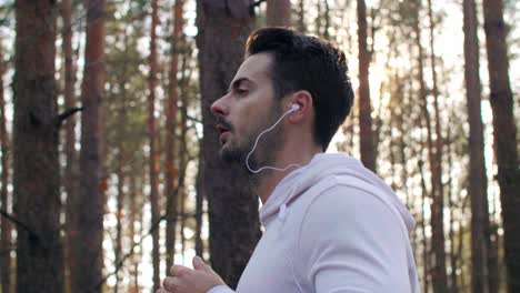 side view of man running and listening to music