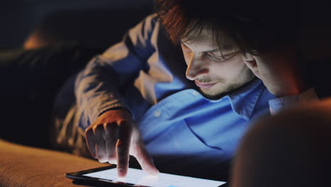 man using tablet computer online shopping at home