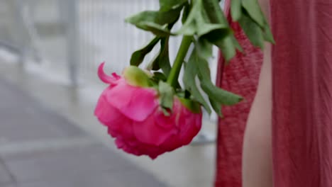 Girl-is-holding-a-flower-then-showing-an-umbrella-and-then-ocean