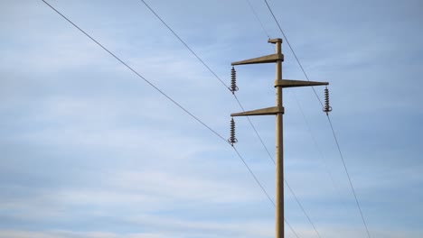 Close-up-of-power-pole-with-sky-in-the-background