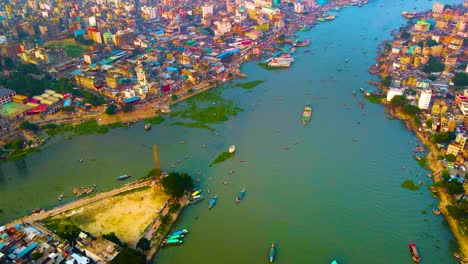 Colorful-buildings-of-megacity-Dhaka-By-Buriganga-river,-Bangladesh,-aerial