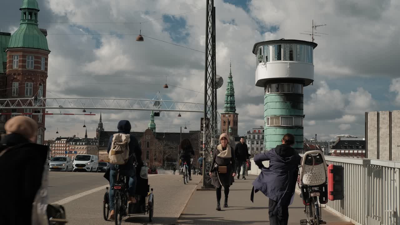 Casual day in Copenhagen city center, cars, cyclists and pedestrians on street