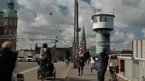 casual day in copenhagen city center, cars, cyclists and pedestrians on street