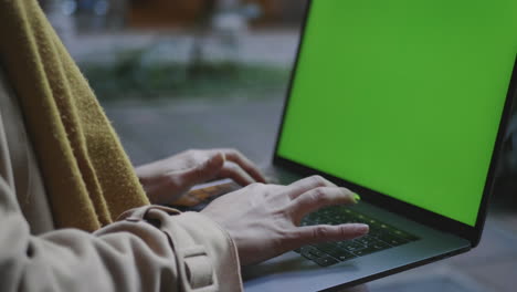 student hands typing laptop keyboard outdoors. businesswoman working on laptop