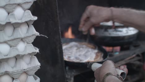 an indian man making an omelette in the street in jodhpur