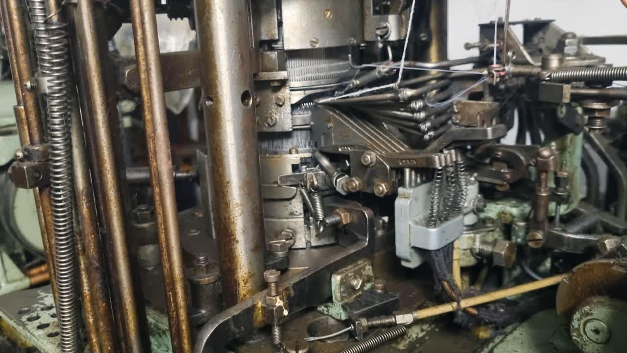 Close-up of a dusty cam drum from a 1950s sock knitting machine, once a key component in Yugoslavia’s textile industry, captured while in motion