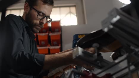 craftsman working on leather products