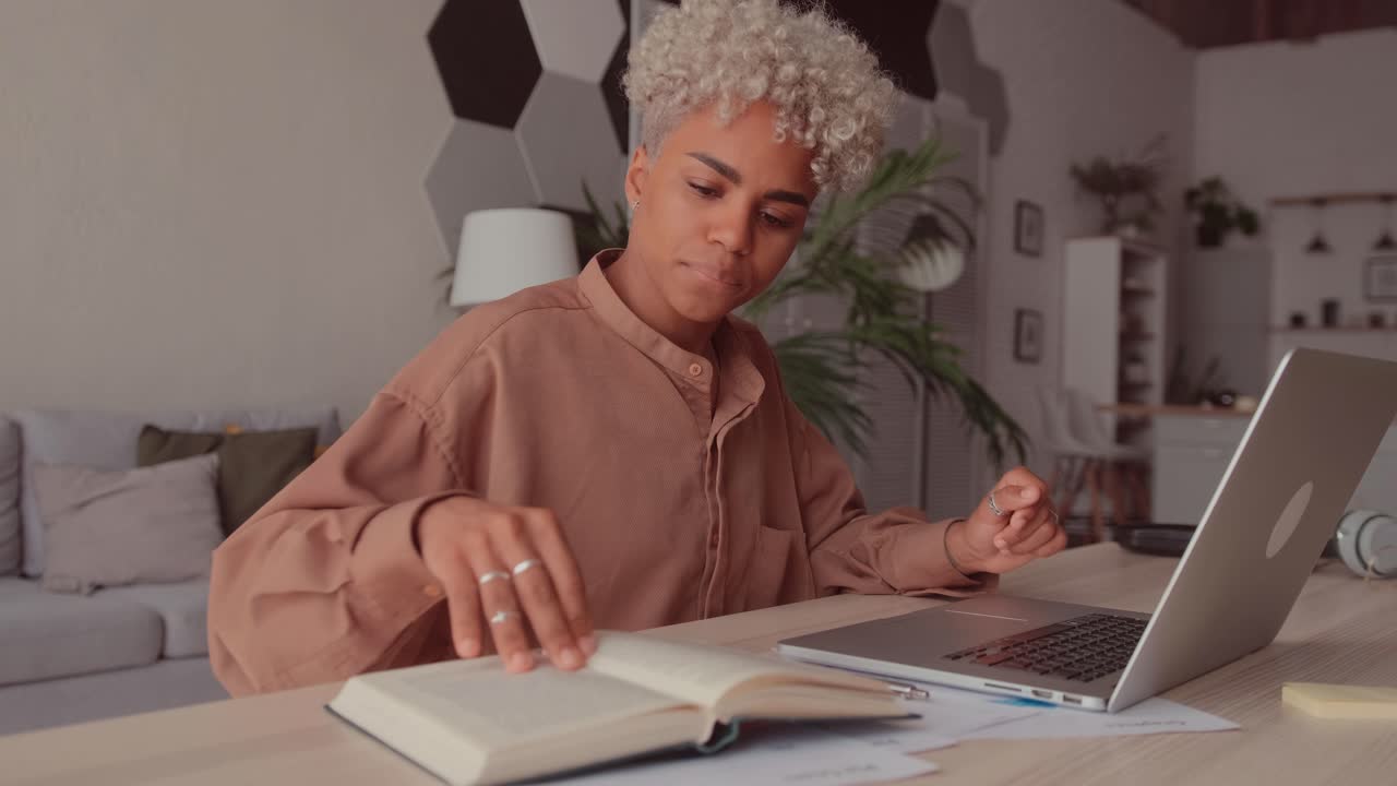 Serious african student woman studying hard prepares for high school exams