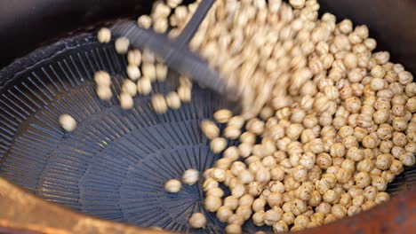 roasted chickpeas being prepared in a large pot