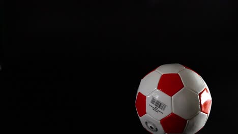 a football bouncing in a dark space