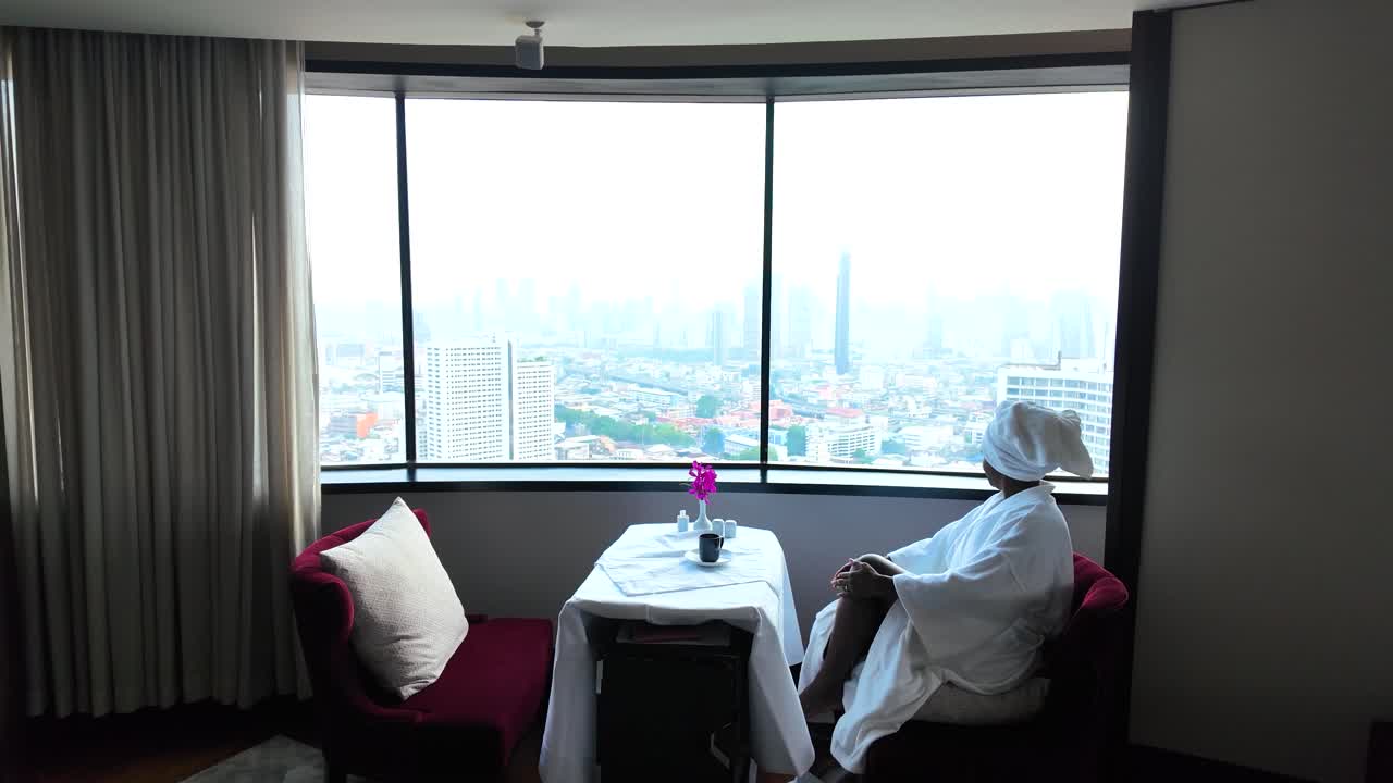 Elegant breakfast with Bangkok skyline view, serene morning moment