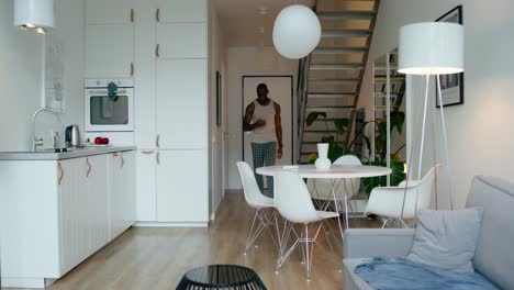 man in a modern apartment kitchen