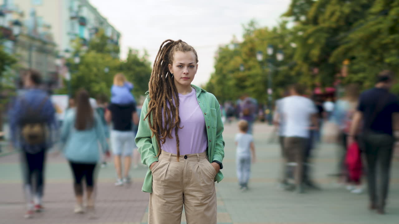 Woman with Dreadlocks on a City Street