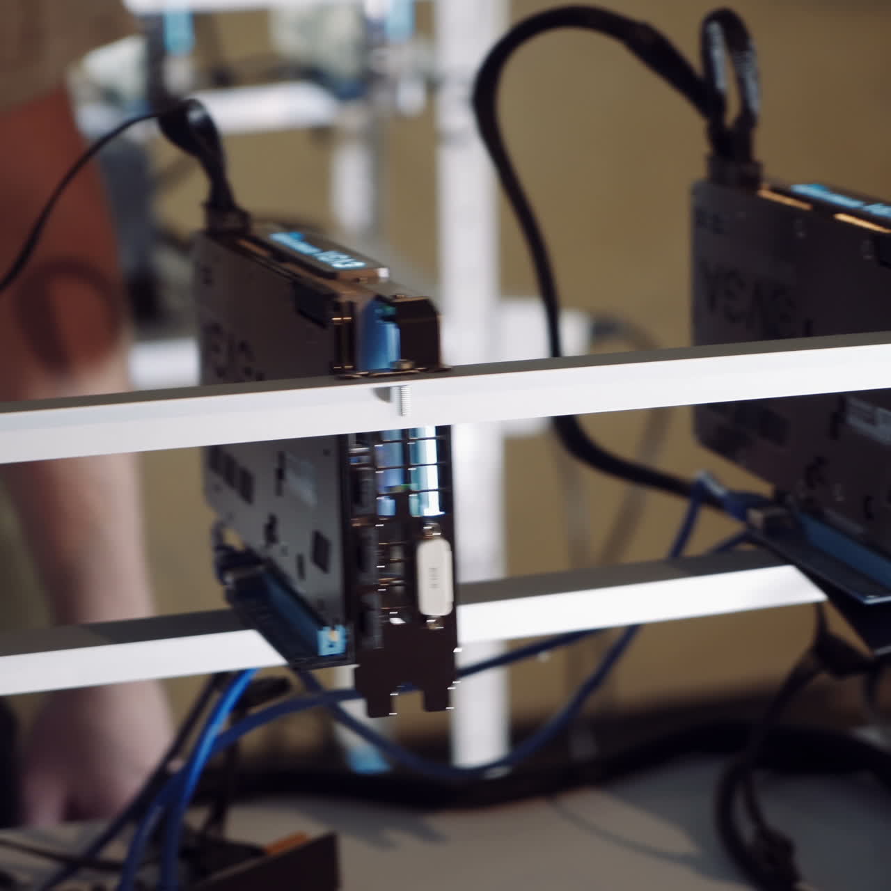 Bitcoin mining farm. Man checks the temperature of the graphics cards on the computer.