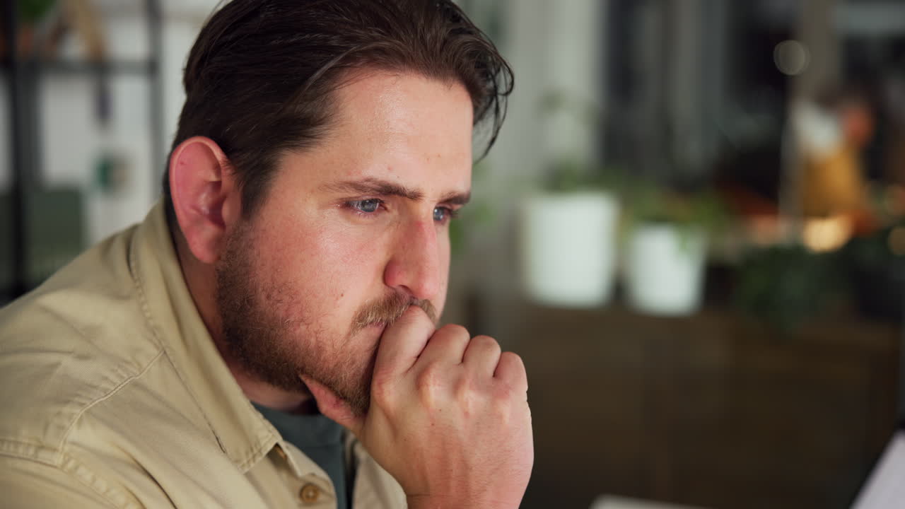 Close-up of Thoughtful Man Concentrating and Problem Solving