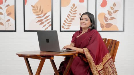 happy indian woman at work