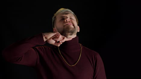 stylish angry dangerous man runs a finger along his neck, want kill someone, criminal look