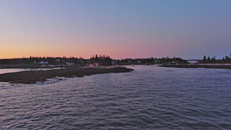 Lovely-sunset-beyond-Hunting-Island,-Southport-Maine-Aerial-tracking-right