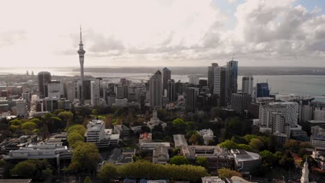 dramatic aerial city scenery of auckland central during cloudy evening