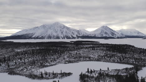 winterly over kathleen lake within kluane national park and reserve in yukon, canada. aerial wide shot