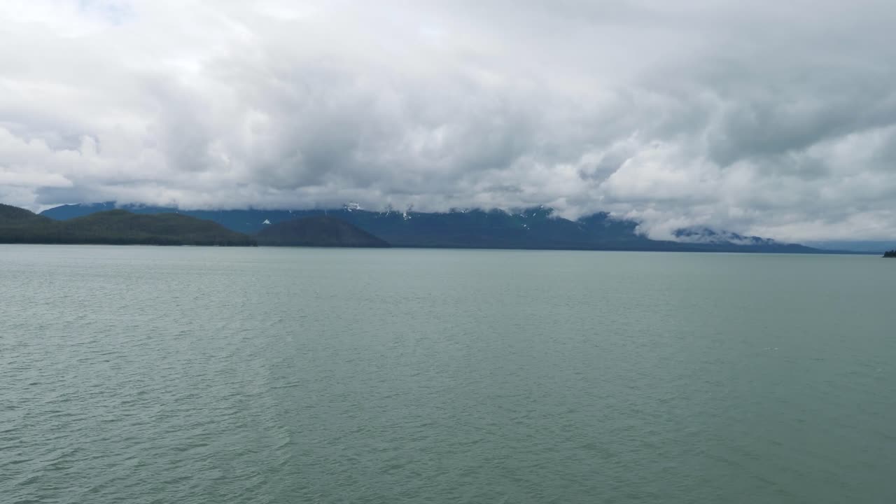 Calm waters of the Gastineau Channel on a cloudy and rainy day. Juneau, Alaska.