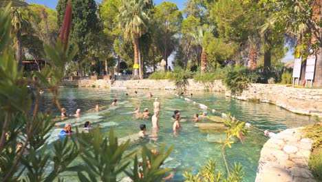pamukkale hot springs: people relaxing in the ancient pools