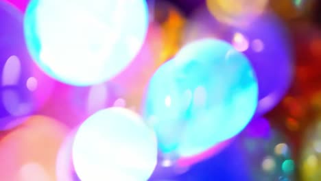 colorful bokeh floats, creating an abstract background filled with vibrant circles and soft, glowing lights