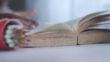 person reading an old book