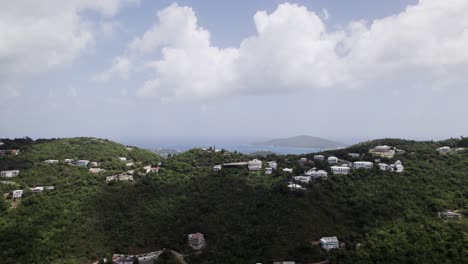 aerial drone shot wide view of homes on mountain cliff st