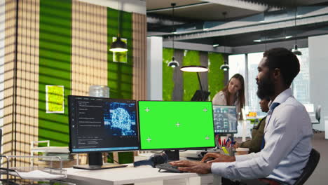 software developer using ai on green screen computer to optimize performance