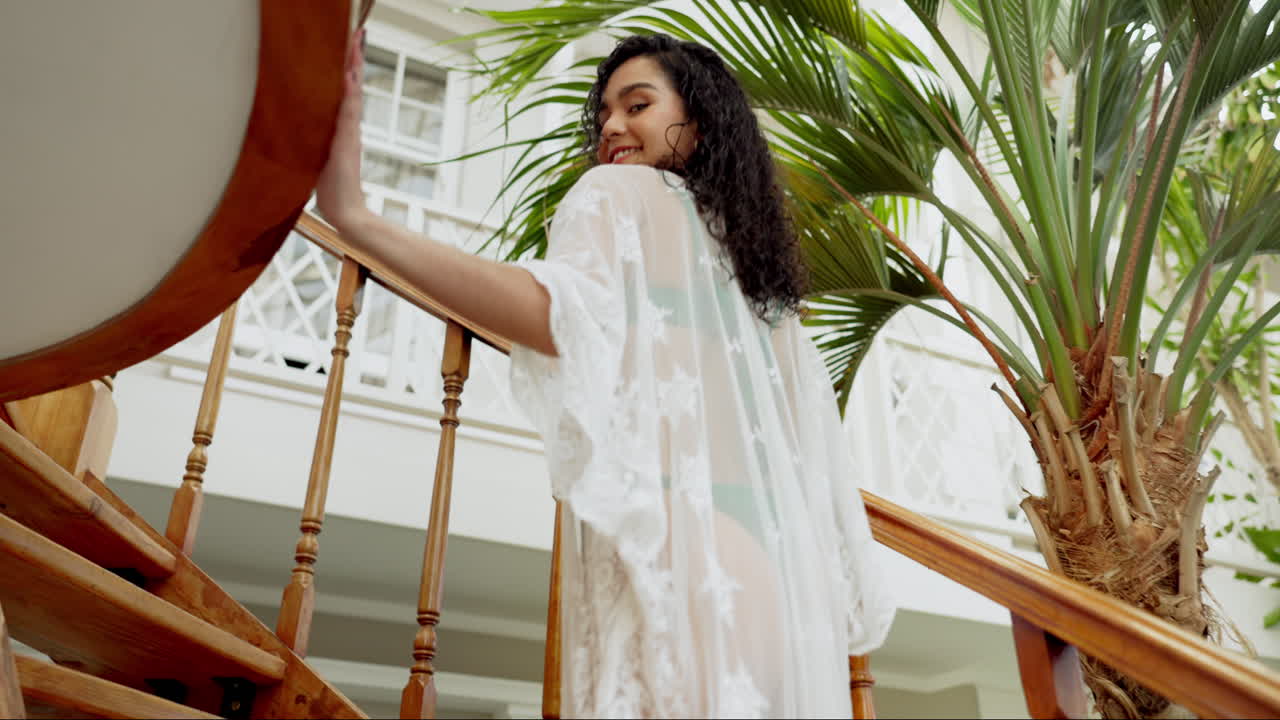 Woman in lace robe on tropical vacation