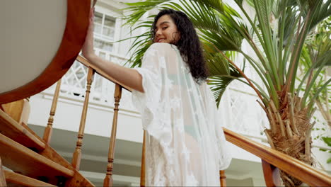 woman in lace robe on tropical vacation
