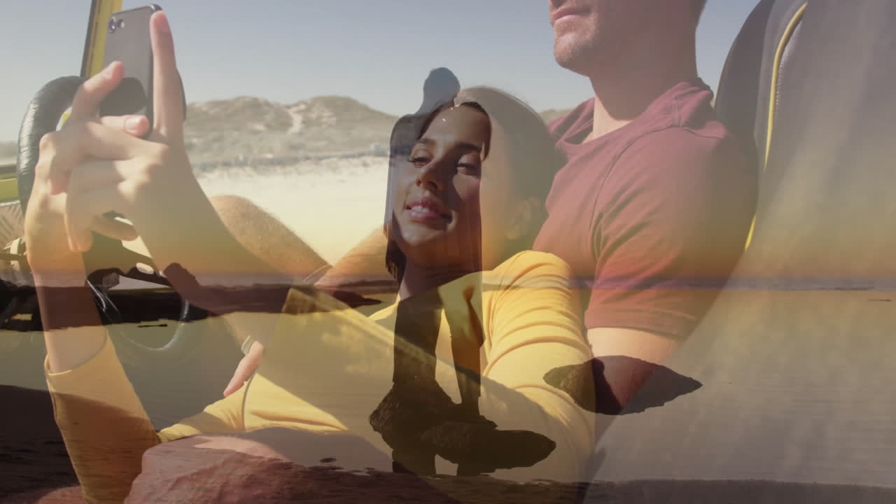 Riding on beach, couple with animation of person walking during sunset