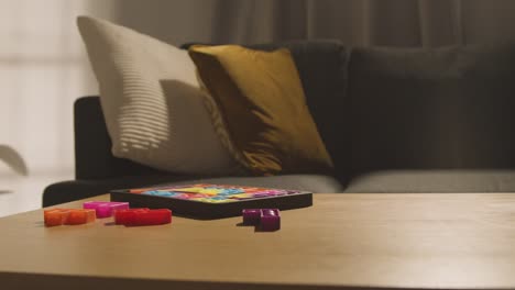 coloured interlocking shape puzzle on table at home for child diagnosed with asd 8