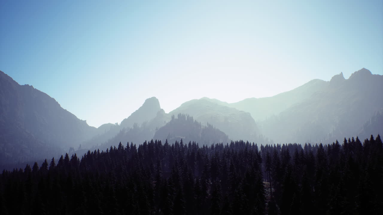 Mountain landscape with forest at sunrise in a peaceful natural setting