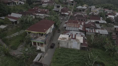 aerial-view,-jeep-group-traveling-through-villages-on-an-expedition