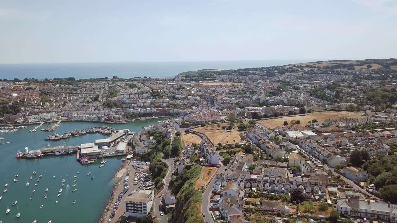 Aerial View of a Coastal Town with Harbor and Sea