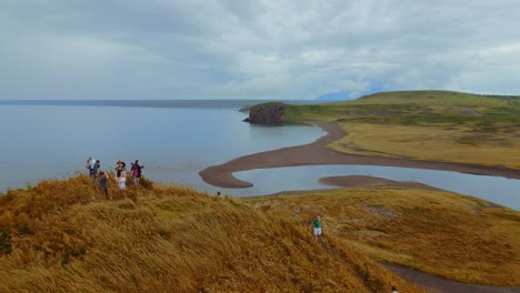 coastal volcanic landscape with people