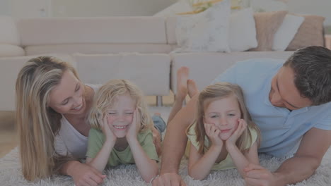 animation of red and blue stars floating over caucasian family playing together