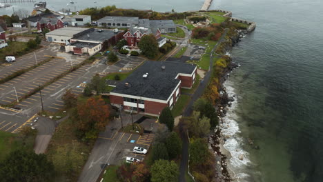 waves crashing along the coast of portland, maine near smcc and the spring point ledge lighthouse in casco bay